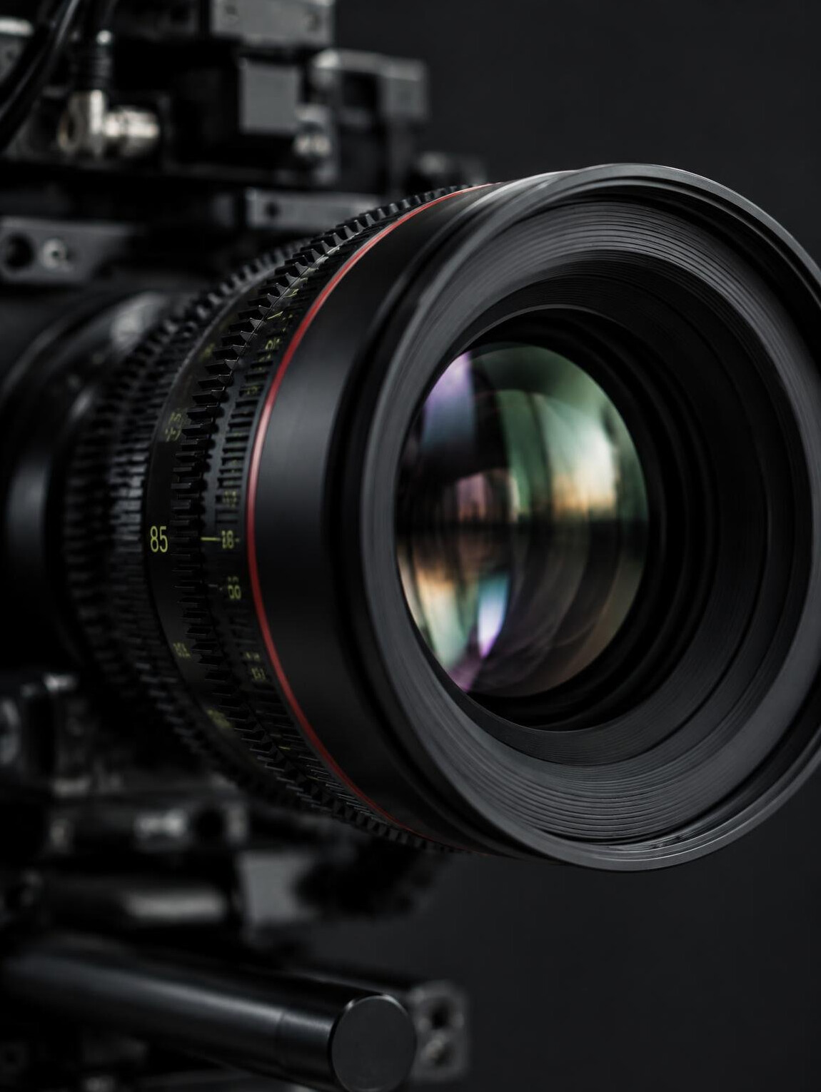 Close-up of a professional camera lens with reflections